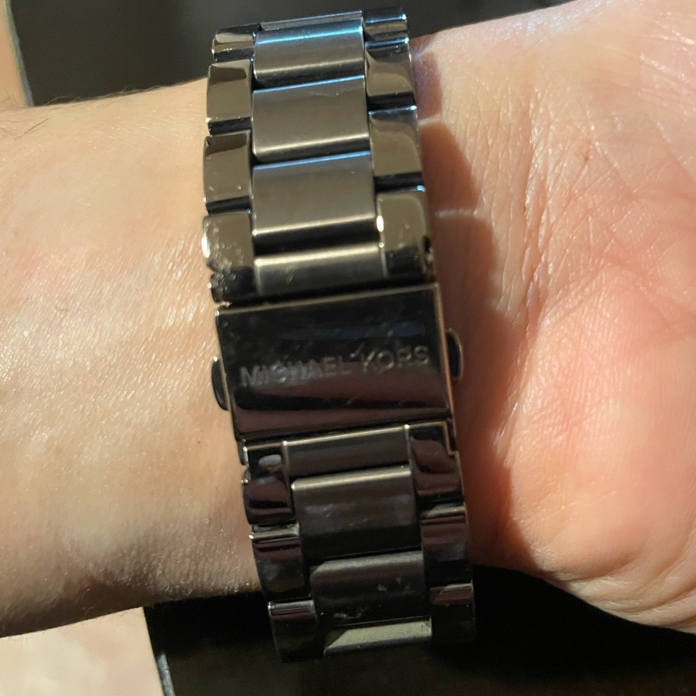 Bronze Michael Kors watch. Needs new battery. Purchased at macys